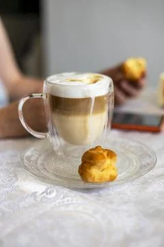 Caf Latte with chocolate chips and eclairs. Stock Photos