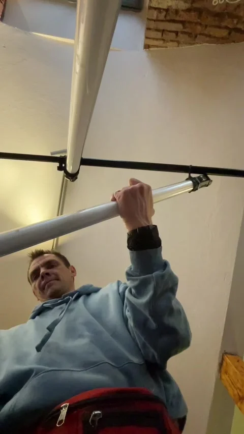 Caf proprietor conducting detailed electrical maintenance on lighting fixture Stock Footage 335435657