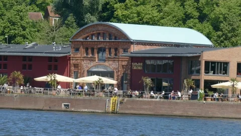 Cafe Bar Celona in an old harbor shed on the banks of the Trave, Lübeck, Schle Video stock 132879185