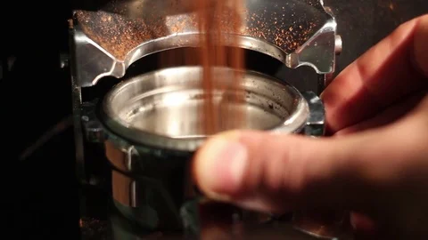Cafe bar coffee grinder pours ground coffee in holder. close up Stock Footage 71669508