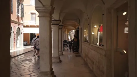 Cafe bar in narrow arcade in Corfu Town,  Corfu, Greece, Europe Stock Footage 277494976