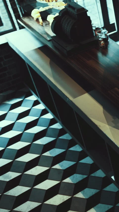 Cafe bar with unique flooring and wooden furniture at a busy location Stock Footage 331662312