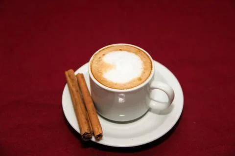 Cafe with cinnamon on board background Stock Photos