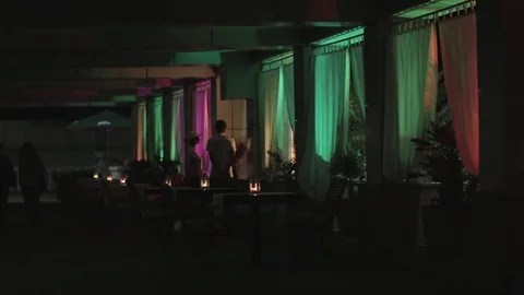 Cafe with color lights at night. Video stock 76734085