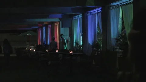 Cafe with color lights at night. Video stock 76735720