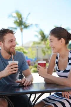 Cafe couple having fun drinking coffee talking Stock Photos