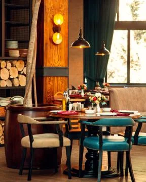 Cafe with custom decor and a tree in a barrel Stock Photos