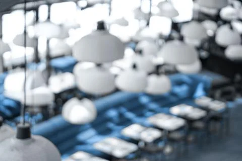 Cafe interior with blue sofa. Blurred background Stock Illustration