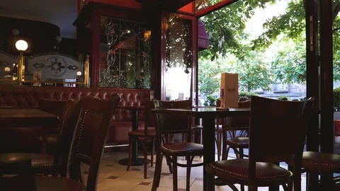Cafe interior with large open doors Stock Footage 79435633