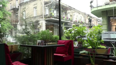 Cafe interior at the rainy day, rain and romantic atmosphere. Stock Footage 135797307