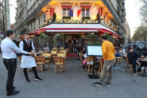 Cafe Le Champ de Mars is traditonal French cafe located near the Eiffel tower Stock Photos
