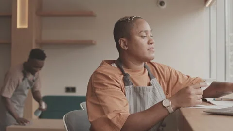 Cafe Manager Using Computer Video stock 164034756