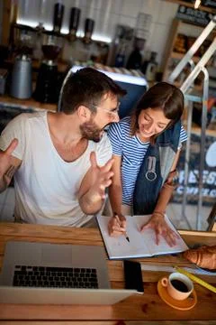 Cafe managers working on laptop in cafe.. Stock Photos