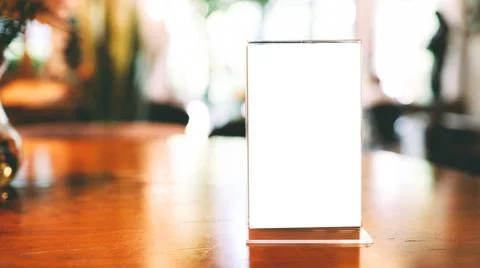 Cafe menu. Menu frame standing on wood table in Bar restaurant cafe. space... Stock-Fotos