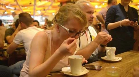 Cafe in Milan. Visitors drinking coffee eating hot chocolate Stock Footage 51226888