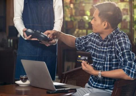 Cafe payment using EMV chip credit card. Stock Photos