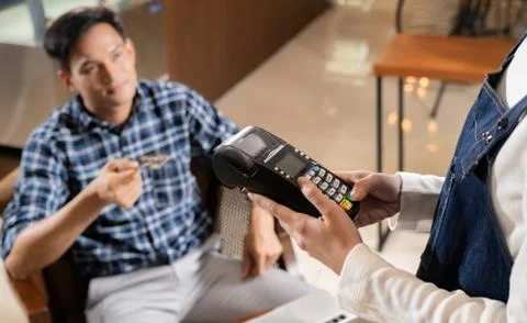 Cafe payment using EMV chip credit card. Stock Photos