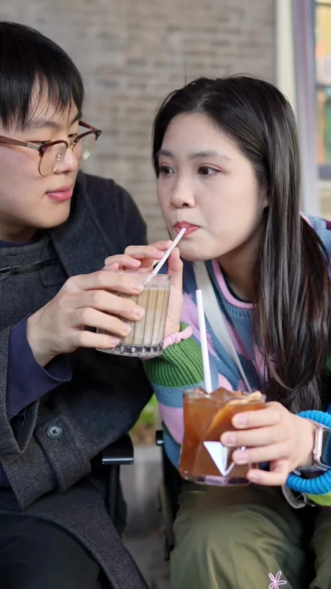 A cafe on a public road where many people walk in Shanghai, China. A young Stock Footage 301712210