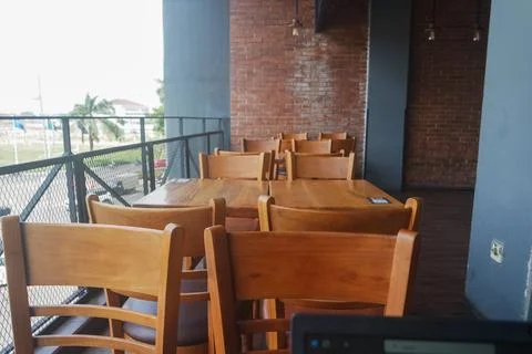 Cafe restaurant background with wooden table and chair Stock Photos