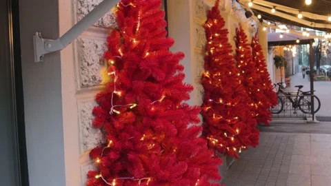Cafe street Christmas tree decorations on the wall of the building 스톡 동영상 144664853