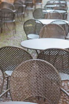 Cafe Table and Chairs on Cobblestone Street, Bologna Stock Photos