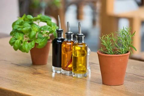 Cafe table with herbs and condiments Stock Photos