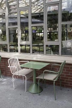 Cafe Table Near Storefront Window Stock Photos