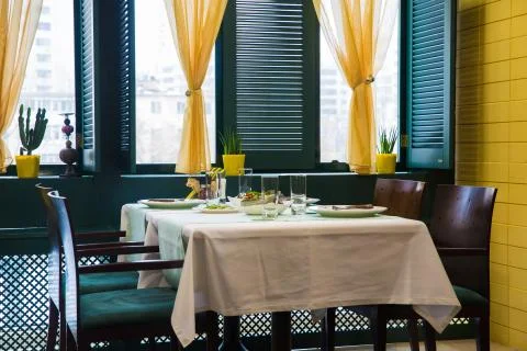 Cafe, table setting, yellow and green color Stock Photos