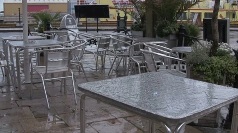 Cafe tables in the rain Stock Footage 7629938