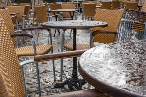Cafe tables in the rain. Stock Photos