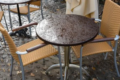 Cafe tables in the rain. Stock Photos