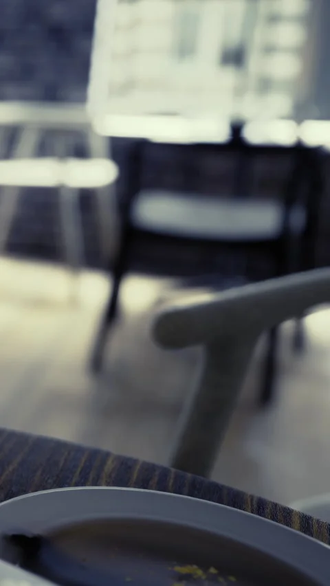 Cafeteria scene with chairs and a plate on the table during the day Video stock 342460159