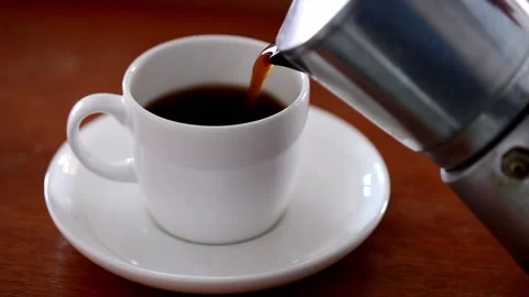 Caffè break with a cup of black coffee cup made with Italian moka Stock Footage 233009915