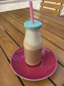 Caffe Latte in a glas bottle Stock Photos