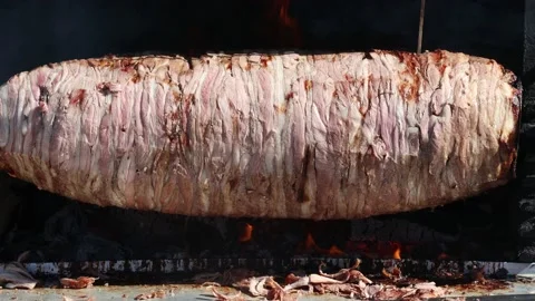 Cag kebab is getting cooked on its charcoal platform Stock Footage 224677941