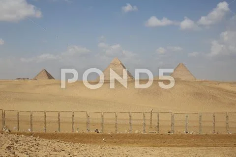 Caged giza pyramids in egypt Stock Photos