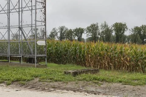 Cages used for drying maize cobs outdoors Stock Photos
