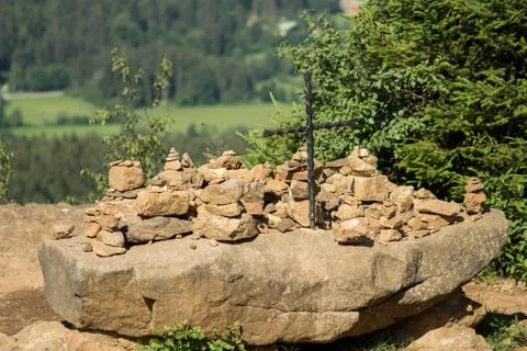 Cairn on a summit with a cross Stock Photos