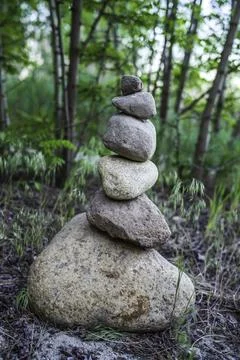 Cairns erected at the edge of the forest Stock Photos