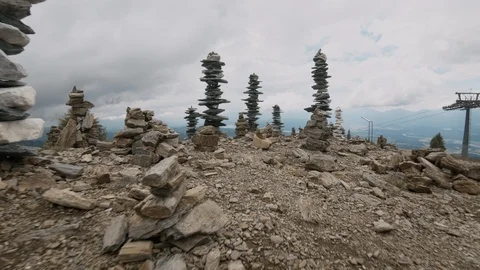 Cairns piled up on top of mountain summit Stock-Footage 97358810
