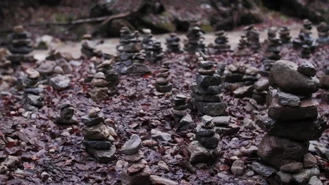 Cairns of stones by the river Stock Footage 183575980