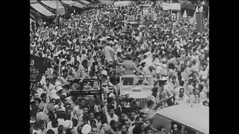 CAIRO - 1956 - Cheering crowds in Cairo bring President Nasser to the Stock Footage 254191830