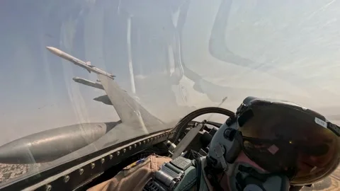 CAIRO - 9.10.2025 - Pilot-facing view inside a USAF F-16 Fighting Falcon as it Stock Footage 327648180