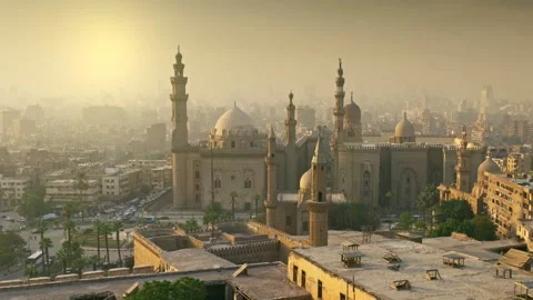 Cairo city in light fog in the rays of setting sun. Zoom out of Mosque of Sultan Stock-Footage 214654898