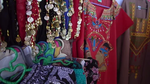 Cairo, Egypt 15 Dec 2019 Sourvenir clothing shirt pants gold necklace selli.. Stock Footage 254757509