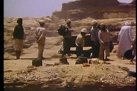 CAIRO, EGYPT, 1977, Archeological site near pyramids, group working, hand trucks Video stock 10740375
