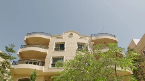 Cairo - Egypt 2 May 2021 : Tiltdown camera movement of villa in daylight Stock Footage 181942957