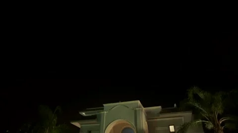 Cairo - Egypt 2 May 2021 : Tiltdown camera movement of villa in night Stock Footage 181946103