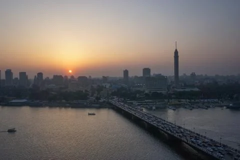 Cairo, Egypt: Cairo Tower and the Qasr el Nile Bridge at sunset Stock Photos