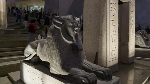 Cairo, Egypt - February 10, 2026: Dark granite sphinx statue with pharaoh face Stock Footage 337190891